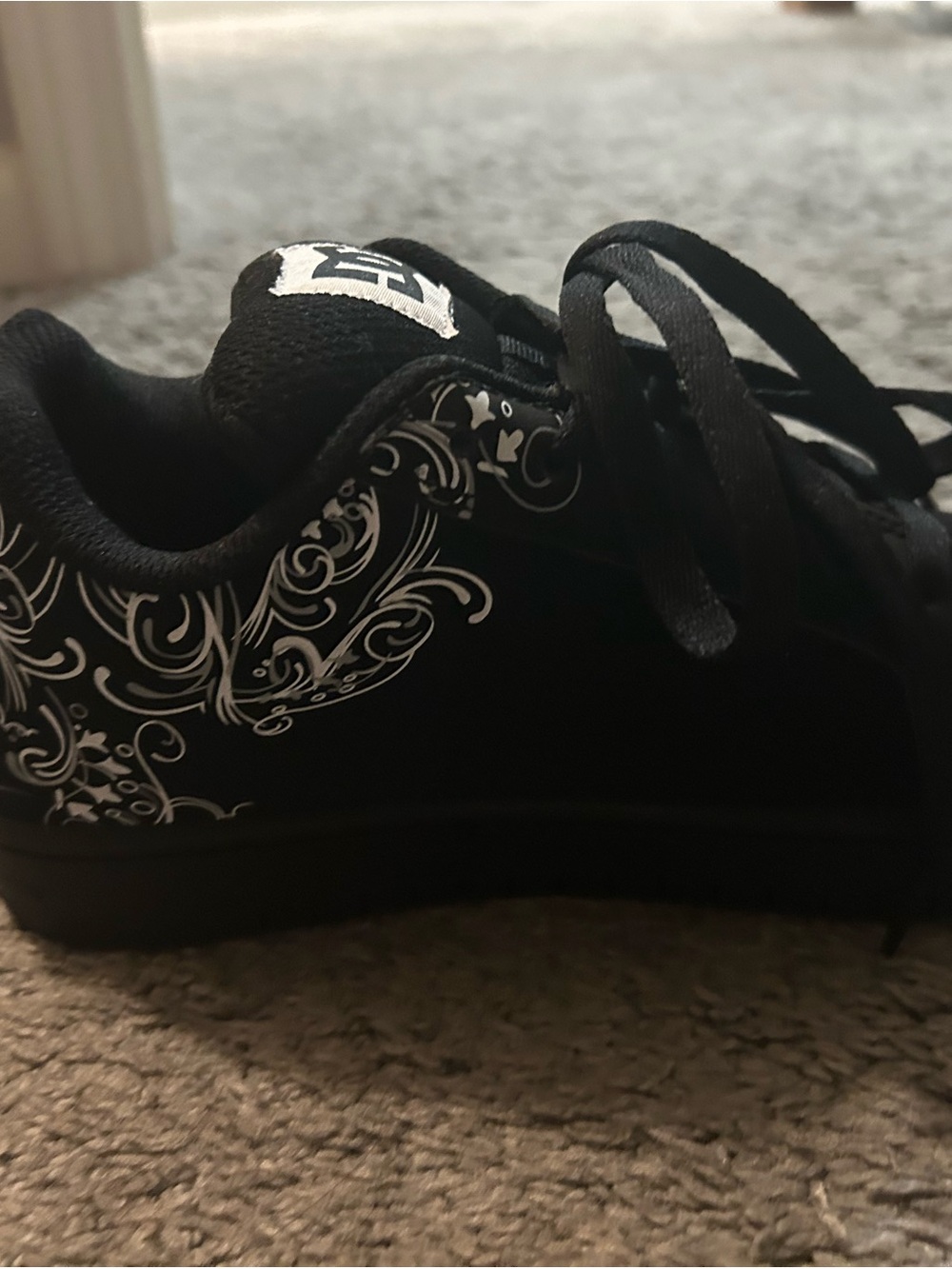 DC Women's Black Sneakers with White Swirl Accent